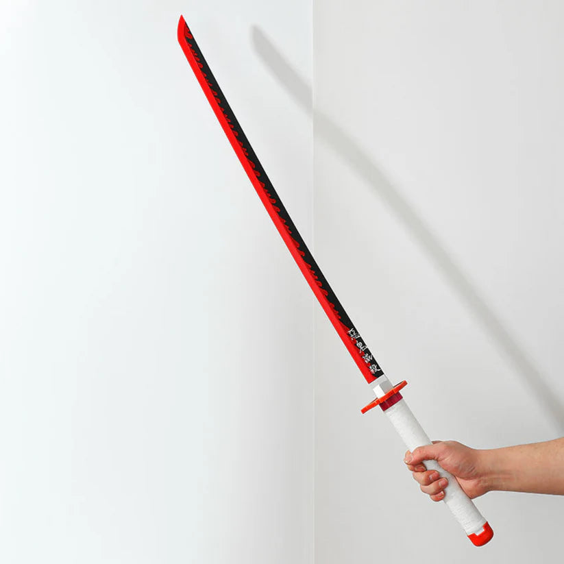 Hand holding red and black anime katana sword with white handle against plain wall