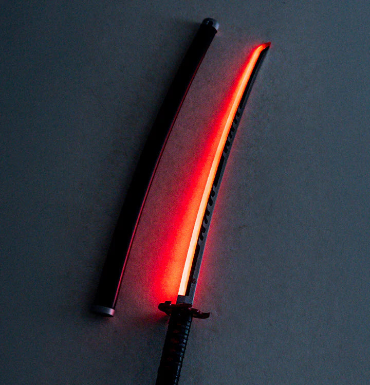 Anime-inspired LED katana with glowing red blade and matching sheath on a flat surface