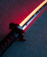 Anime-inspired LED katana with illuminated blade and detailed hilt on a dark surface