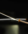 Anime LED katana sword with yellow hilt and glowing blade on display against black background