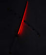 Red LED katana sword with glowing blade and white handle, anime collectible